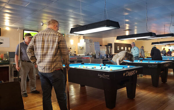 Game night at 2022 Reader reunion. Playing pool, darts, games.